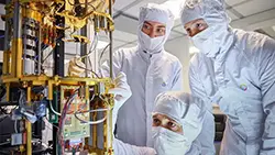 A closeup of 3 clean room technicians working on a gold quantum computer.