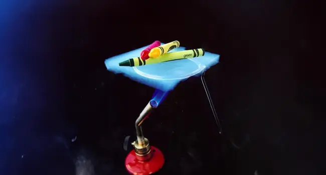 crayons on top of the aerogel are protected from the flame underneath, and are not melting
