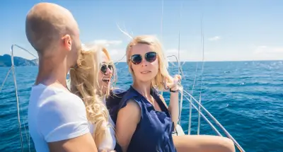 Three young people on a yacht