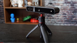 a 3d scanner on a small tripod