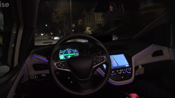 view of a driverless car at night from the backseat