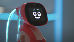 A view of a red robot for kids with a screen for a face
