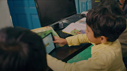 boy in classroom using a tablet