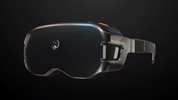 A closeup view of a pair of bulky black glasses that look like opaque VR goggles. There is a small opening in the center of the glasses probably for a camera