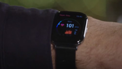 a closeup of a smartwatch on a man's wrist