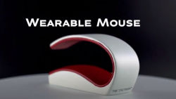 a slip-on wearable mouse that is shown wrapped around the front and back of a person's palm