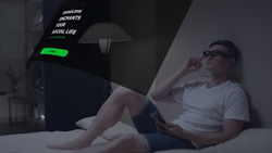 A person is laying in bed wearing AR glasses. An overlay of a menu is floating in the air in front of them.