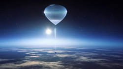 A view of the nearly flat curvature of the Earth, with the Sun rising, lighting the blue atmosphere on the horizon. A silver space balloon with a capsule attached at the end of a long cable is in the center of the picture at a distance.